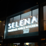 The Selena Bar & Kitchen sign above the entrance.