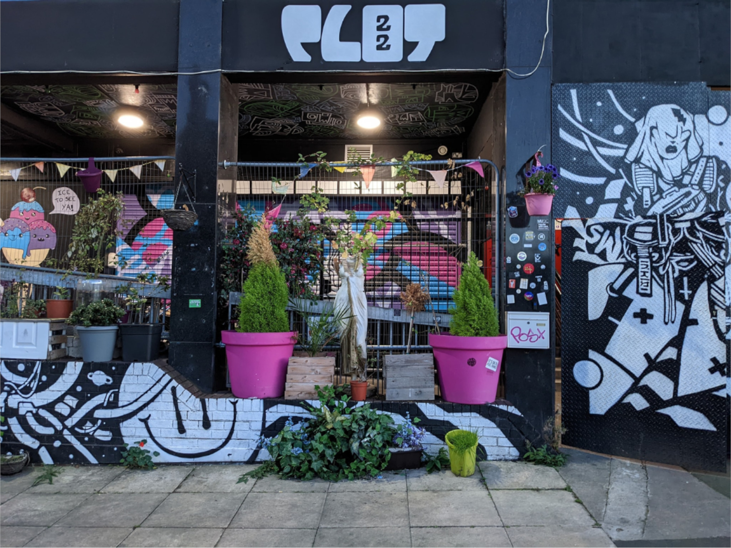 Exterior of Plot 22, which is decorated by several murals.