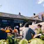 People enjoying the sunny exterior of Alder Sheffield in Kelham Island 