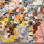 Plates of fresh Turkish food laid out on a table.