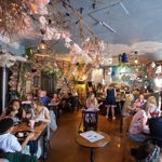 Interior of The Steel Cauldron. All the tables are filled with people eating and drinking.