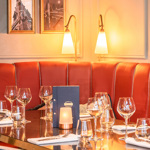 A booth at Browns Sheffield with red leather upholstery.