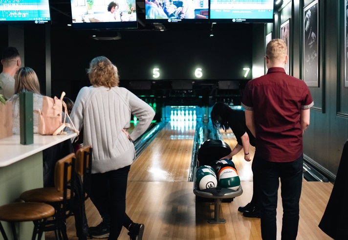 People bowling at Clubhouse.