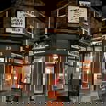 The exterior of the Two Sheds at night.