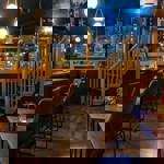 Seating and tables under the vaulted ceiling at True Loves.