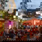 People dining outside at Terrace Goods, in the evening.