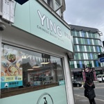a picture outside the shop which shows the sign on top which reads Ying Chinese bakery and cafe