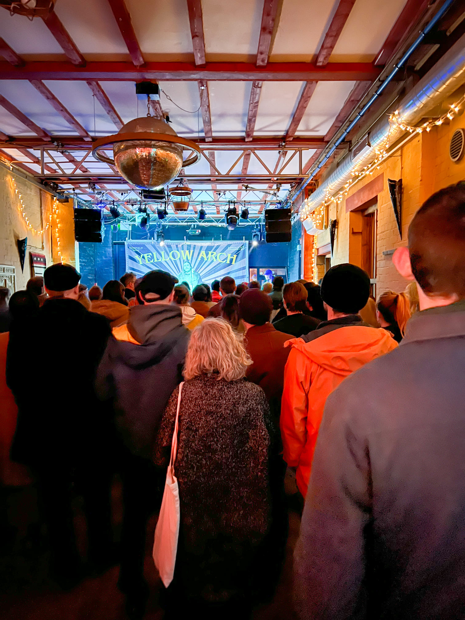 A crowd watches a band performing at Yellow Arch.