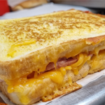 A grilled ham & cheese sandwich.