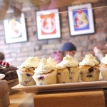A row of cupcakes on the counter at Made by Jonty.